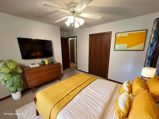 6480 Long Lake Rd, Willmar, MN 56201 - bedroom with a closet, a textured ceiling, ceiling fan, and light carpet