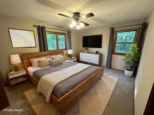 6480 Long Lake Rd, Willmar, MN 56201 - carpeted bedroom featuring a textured ceiling and a ceiling fan