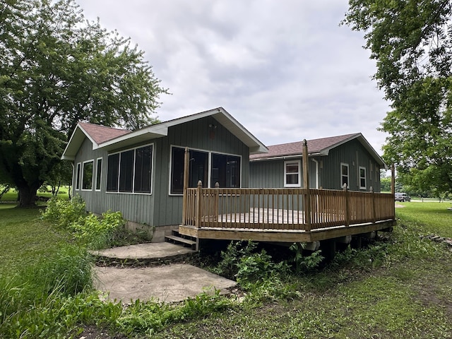 6480 Long Lake Rd, Willmar, MN 56201 - back of house with a deck and roof with shingles