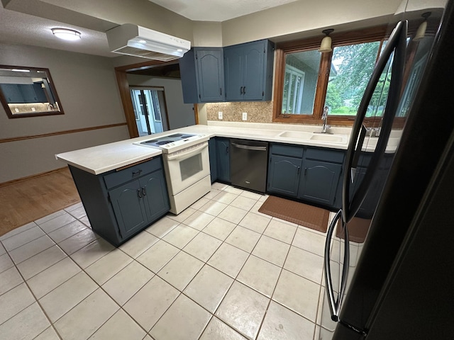 6480 Long Lake Rd, Willmar, MN 56201 - kitchen with dishwashing machine, white range with electric cooktop, a peninsula, freestanding refrigerator, and light tile patterned floors