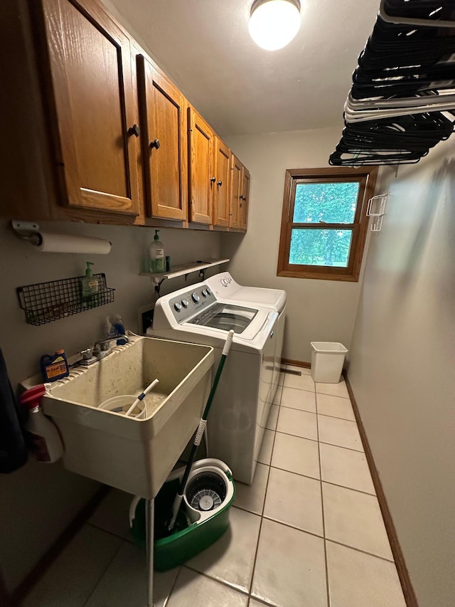 6480 Long Lake Rd, Willmar, MN 56201 - laundry area with separate washer and dryer, light tile patterned floors, and cabinet space