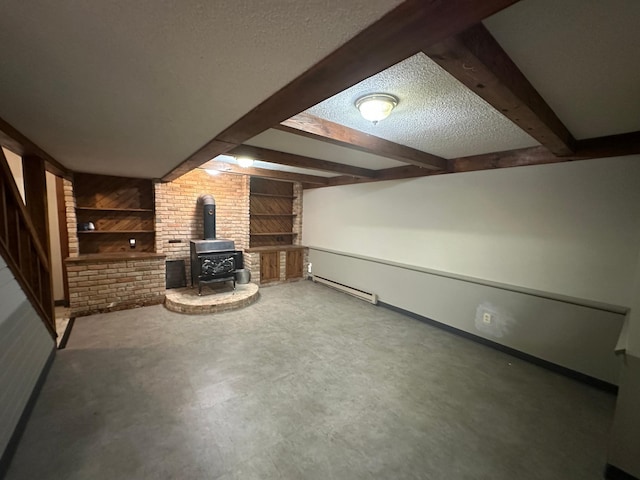 6480 Long Lake Rd, Willmar, MN 56201 - unfurnished living room with a wood stove, beam ceiling, a textured ceiling, baseboard heating, and wooden walls