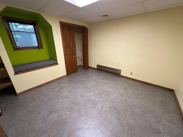 6480 Long Lake Rd, Willmar, MN 56201 - unfurnished room featuring a baseboard heating unit and a drop ceiling