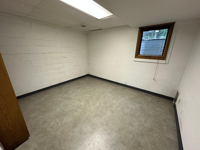 6480 Long Lake Rd, Willmar, MN 56201 - empty room with concrete floors, concrete block wall, and a drop ceiling