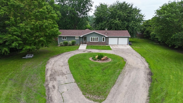 6480 Long Lake Rd, Willmar, MN 56201 - ranch-style house with driveway, an attached garage, and a front yard