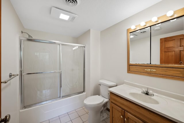 33373 Lakes Trl, Chisago Lake Twp, MN 55045 - bathroom with tile patterned floors, toilet, vanity, and bath / shower combo with glass door