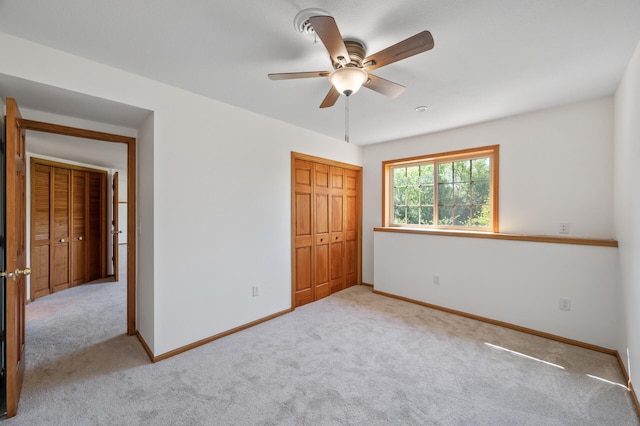 33373 Lakes Trl, Chisago Lake Twp, MN 55045 - unfurnished bedroom featuring carpet flooring, a closet, baseboards, and ceiling fan