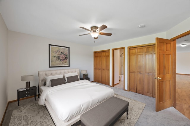 33373 Lakes Trl, Chisago Lake Twp, MN 55045 - bedroom with multiple closets, light carpet, baseboards, and a ceiling fan