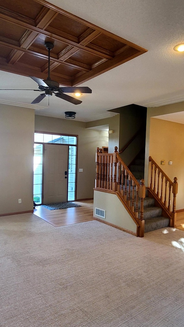 1404 19th Ave NW, Faribault, MN 55021 - foyer featuring carpet, a ceiling fan, stairway, and crown molding