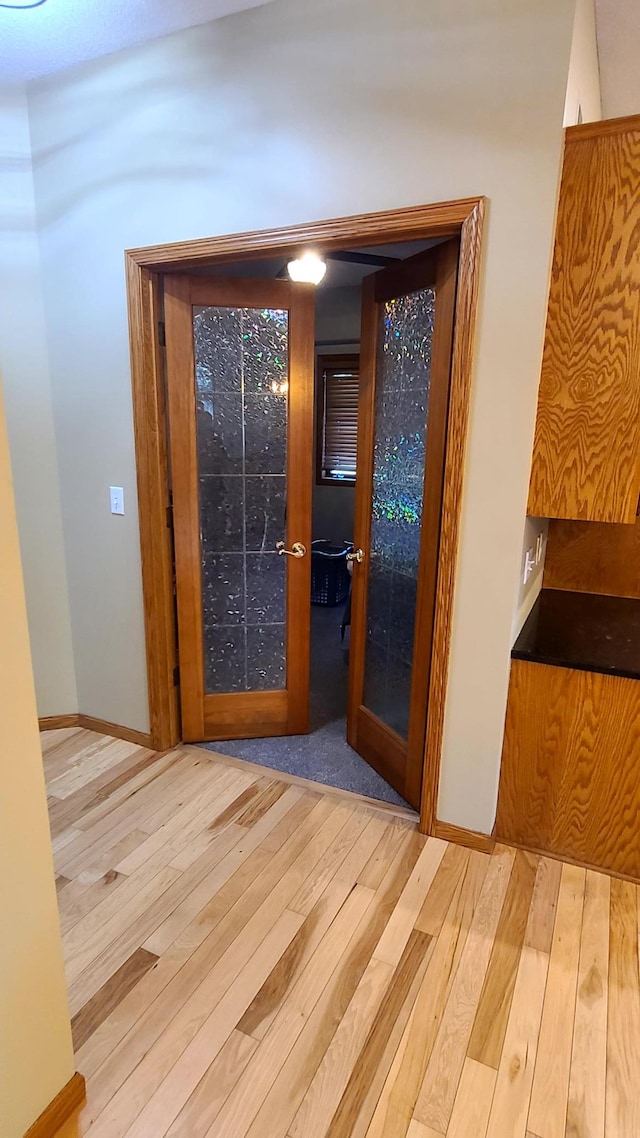 1404 19th Ave NW, Faribault, MN 55021 - corridor with hardwood / wood-style floors and french doors
