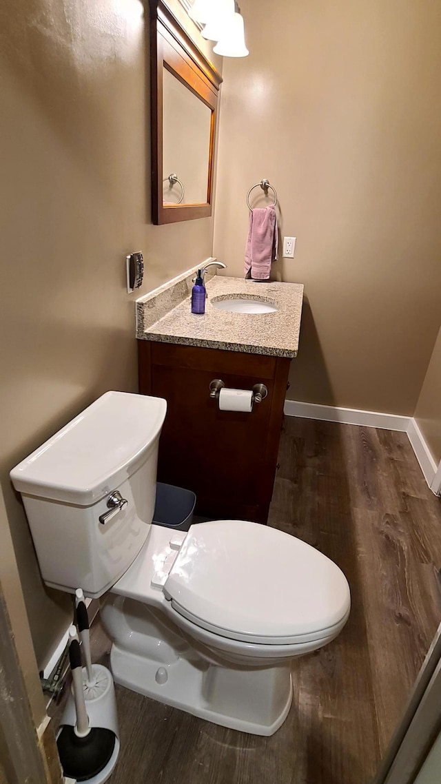 1404 19th Ave NW, Faribault, MN 55021 - bathroom featuring wood finished floors and vanity