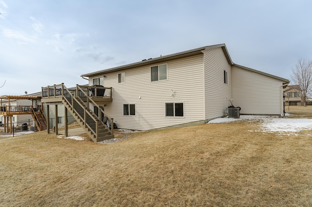 4846 Lionhart Dr NW, Rochester, MN 55901 - rear view of house with central AC unit, a lawn, stairs, and a deck
