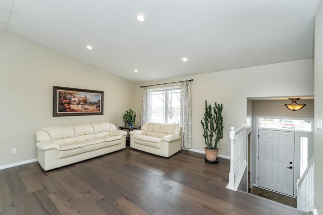 4846 Lionhart Dr NW, Rochester, MN 55901 - living room featuring dark wood-style floors, recessed lighting, baseboards, and lofted ceiling