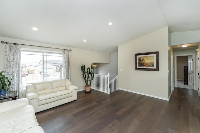4846 Lionhart Dr NW, Rochester, MN 55901 - living area featuring vaulted ceiling, wood finished floors, and baseboards