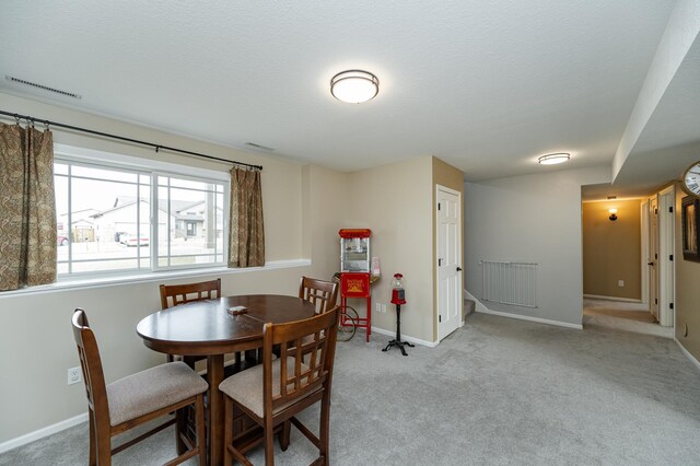 4846 Lionhart Dr NW, Rochester, MN 55901 - carpeted dining space featuring stairs, visible vents, and baseboards