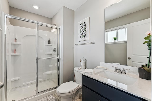 12972 Bauer Dr N, Champlin, MN 55316 - bathroom with toilet, a stall shower, and vanity