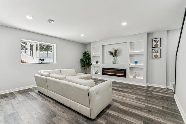 12972 Bauer Dr N, Champlin, MN 55316 - living room with a glass covered fireplace, recessed lighting, baseboards, and dark wood-type flooring