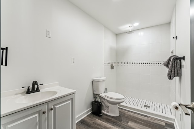 12972 Bauer Dr N, Champlin, MN 55316 - full bath with a tile shower, toilet, vanity, and wood finished floors
