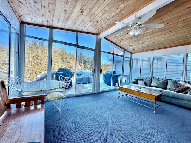 sunroom featuring ceiling fan and outdoor lounge area