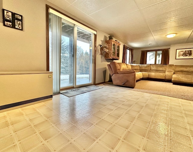 unfurnished living room with tile patterned floors