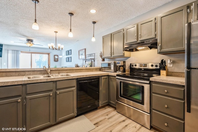 3040 Shields Dr Unit 102, Eagan, MN 55121 - kitchen with appliances with stainless steel finishes, under cabinet range hood, a sink, a textured ceiling, and gray cabinetry