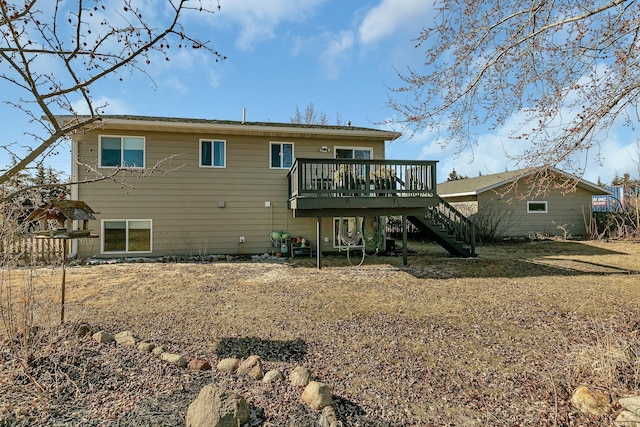 rear view of house with a deck and stairs