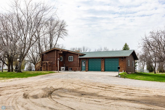 301 3rd Ave S, Borup, MN 56519 - view of front facade featuring driveway, a chimney, roof with shingles, a front yard, and a garage