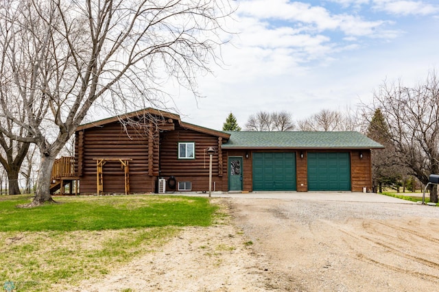 301 3rd Ave S, Borup, MN 56519 - log home with a garage, a shingled roof, driveway, and a front yard