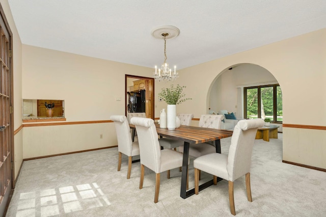 5853 Deer Trail Cir, Woodbury, MN 55129 - carpeted dining area featuring a chandelier and arched walkways