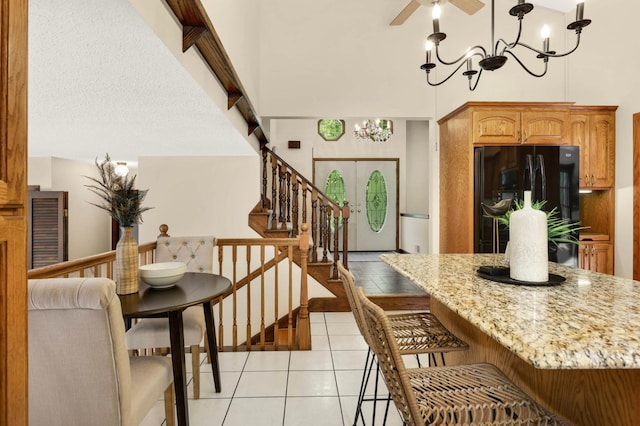 5853 Deer Trail Cir, Woodbury, MN 55129 - dining area with a chandelier, light tile patterned floors, stairs, and a ceiling fan