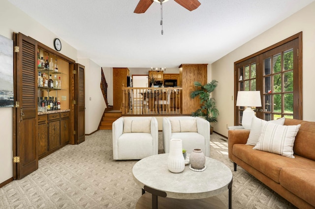 5853 Deer Trail Cir, Woodbury, MN 55129 - living room featuring stairs, ceiling fan, and light colored carpet
