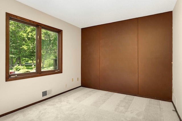 5853 Deer Trail Cir, Woodbury, MN 55129 - empty room featuring baseboards and light carpet