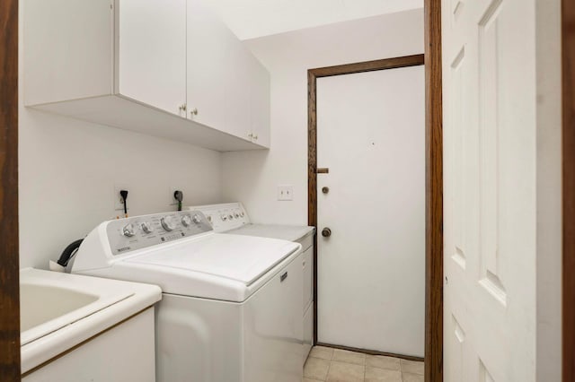 5853 Deer Trail Cir, Woodbury, MN 55129 - laundry area with cabinet space, washing machine and dryer, and light tile patterned floors