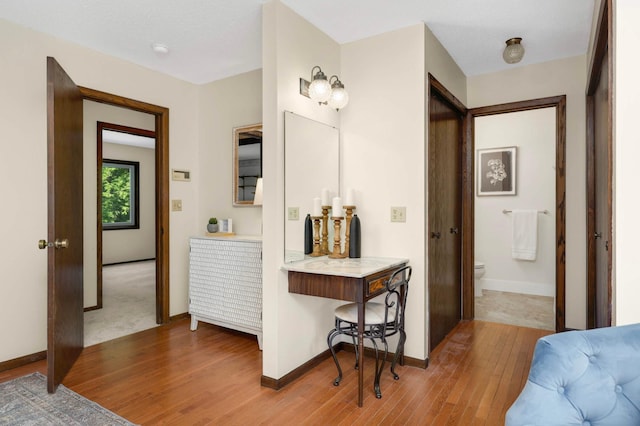5853 Deer Trail Cir, Woodbury, MN 55129 - bathroom featuring wood finished floors and toilet