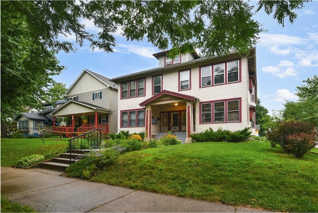traditional style home with stucco siding and a front lawn