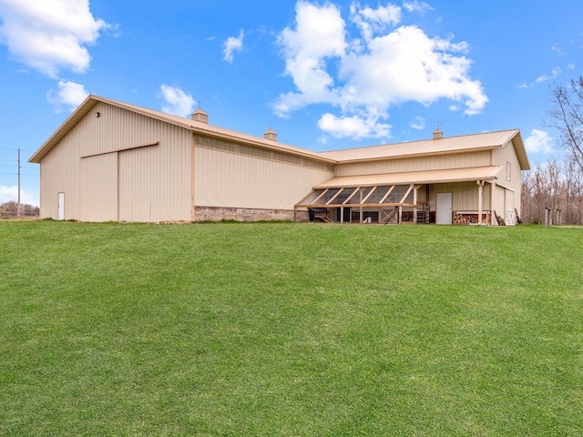 22184 Iman St NW, Nowthen, MN 55330 - rear view of property with a pole building, a chimney, a yard, and an outbuilding