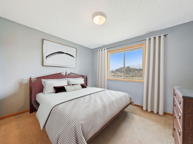 22184 Iman St NW, Nowthen, MN 55330 - bedroom featuring light carpet, baseboards, and a textured ceiling