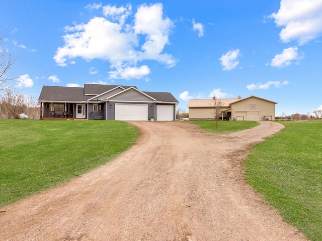 22184 Iman St NW, Nowthen, MN 55330 - ranch-style home featuring driveway, an attached garage, a front yard, and a porch