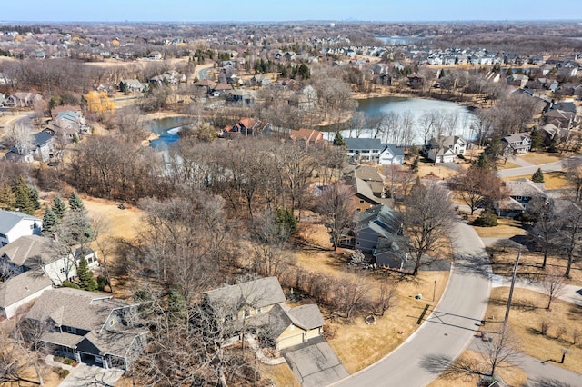 birds eye view of property with a water view and a residential view