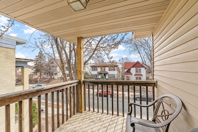 wooden deck with a residential view
