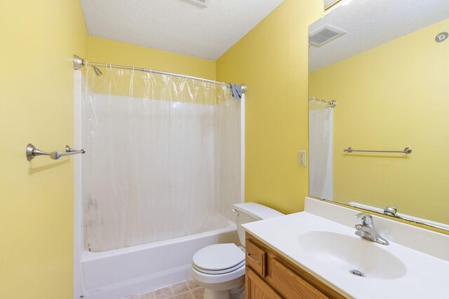 full bath featuring toilet, vanity, a textured ceiling, and visible vents