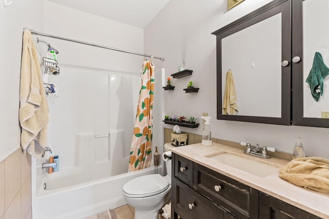 bathroom featuring toilet, vanity, and shower / bath combo