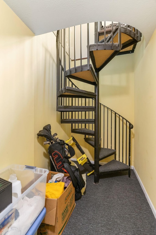 stairs with carpet and baseboards