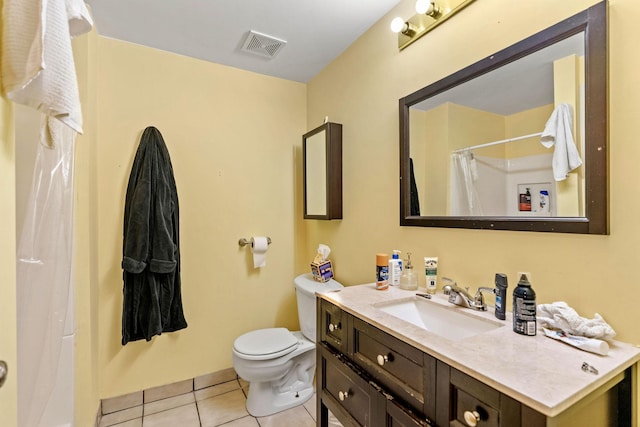 bathroom featuring vanity, toilet, tile patterned floors, visible vents, and curtained shower