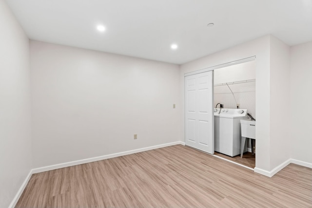 laundry room featuring washer / clothes dryer, baseboards, light wood-style floors, and recessed lighting