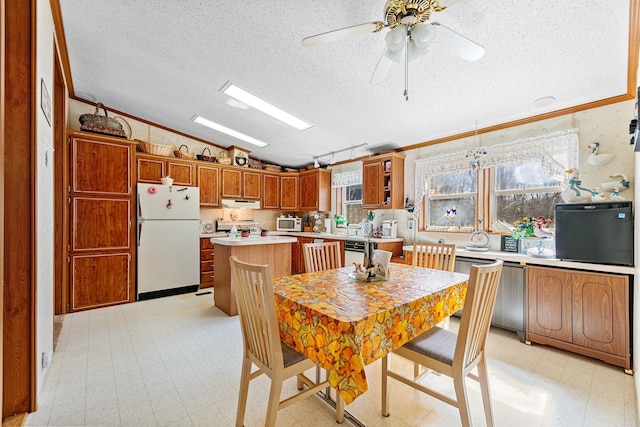 18482 Captive Lake Rd, Kathio Twp, MN 56450 - kitchen with white appliances, light floors, lofted ceiling, light countertops, and a textured ceiling