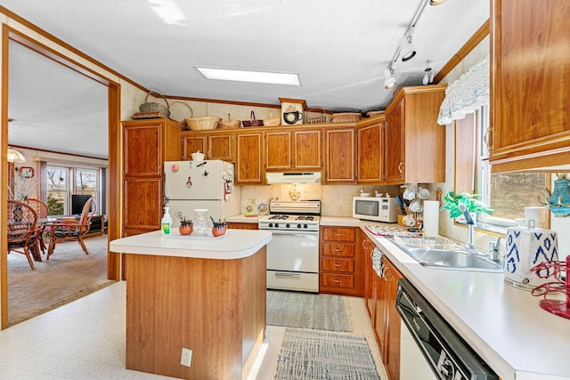 18482 Captive Lake Rd, Kathio Twp, MN 56450 - kitchen with white appliances, under cabinet range hood, vaulted ceiling, light countertops, and light floors