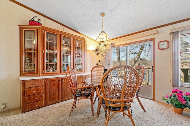 18482 Captive Lake Rd, Kathio Twp, MN 56450 - dining area featuring crown molding, light colored carpet, plenty of natural light, a textured ceiling, and vaulted ceiling