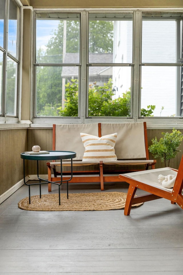 851 Watson Ave, Saint Paul, MN 55102 - sunroom / solarium featuring healthy amount of natural light, wood walls, and wood finished floors