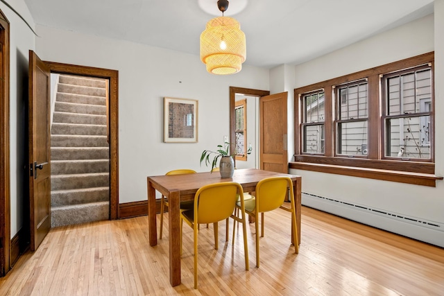 851 Watson Ave, Saint Paul, MN 55102 - dining space with light wood-style flooring, baseboard heating, and baseboards